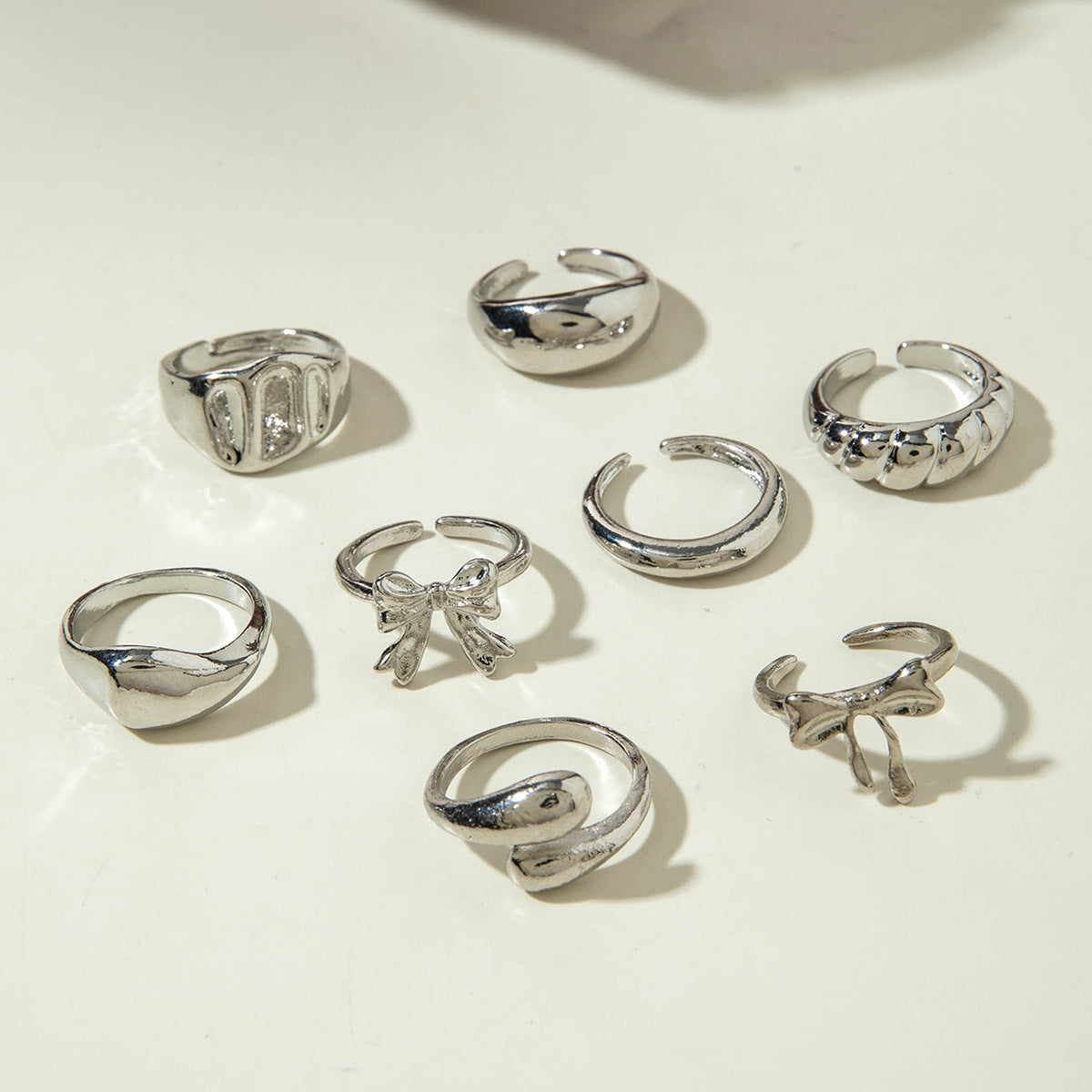 UNI-11115-8 - Bow & Mix Silver - Ring Set Of 8