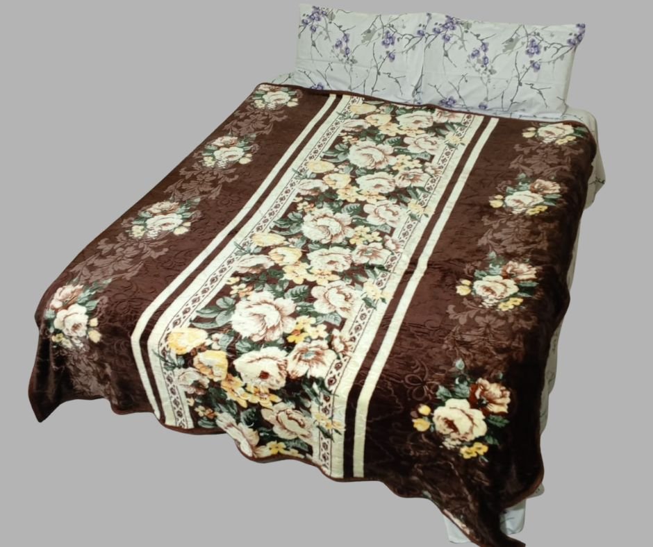 Brown floral bed blanket with cream and yellow flowers on a double bed