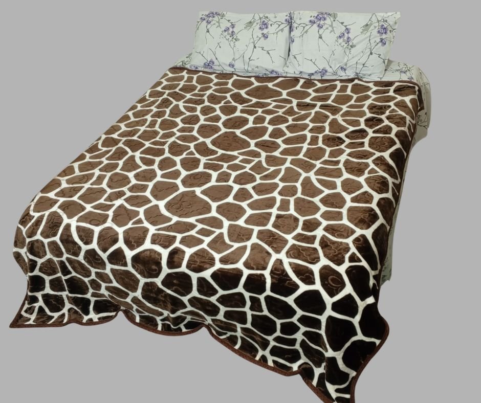 Brown giraffe print bedspread on a bed with floral pillows, gray background